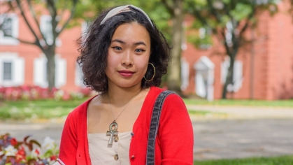 Student sitting outside on the Rutgers campus
