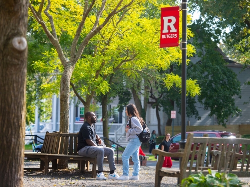 Students talking on campus during the summer