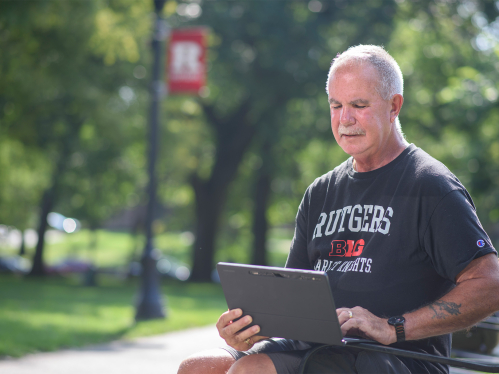 Student sitting looking at laptop
